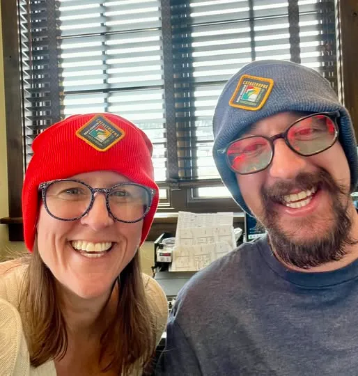 Two team members wearing original RMCAT logo beanies