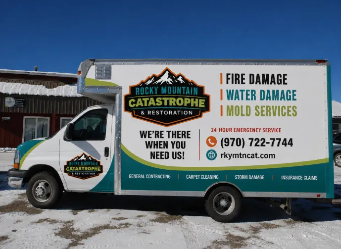 Rocky Mountain Catastrophe box truck parked in the snow at the Tabernash office